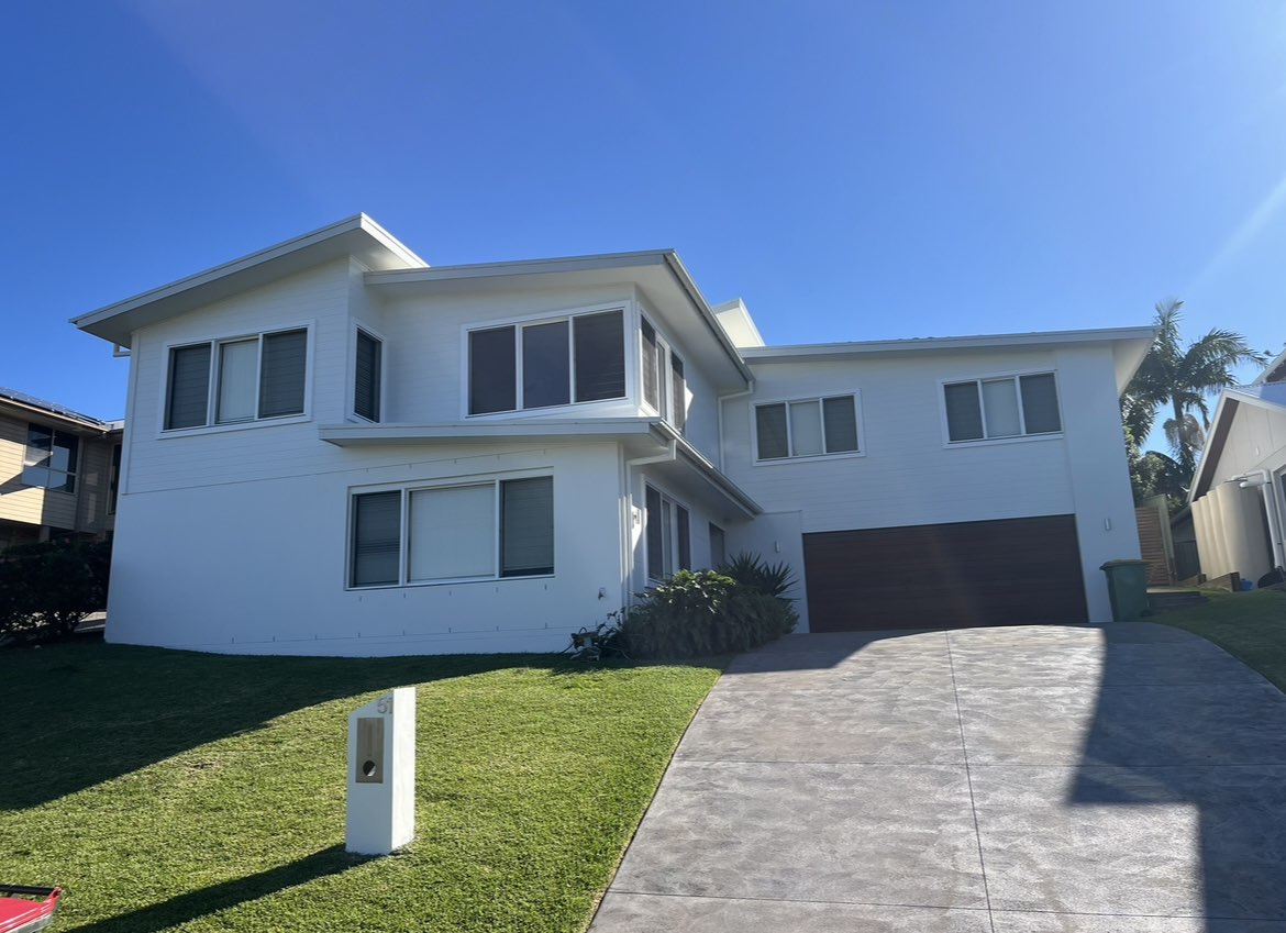 A photo of a house with a fresh exterior coat of paint.